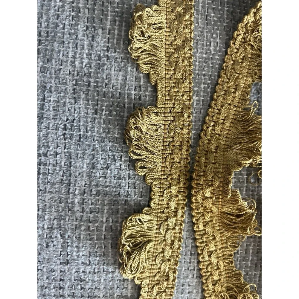 Gold Woven petersham tape textured looped sawtooth style scallop edge. 1 yd 11”